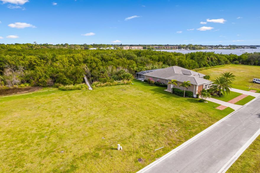 Exclusive Waterfront Construction! Vacant land of .34 acres with dock for sale. Embedded in the double gated private Island of Ravello community. Located on the St Lucie River, in the Treasure Coast known for its tranquil nature with full ocean access 25 minutes away, no bridges. ELEGANCE & LIFESTYLE! Trails, Kayaking, Tennis Courts, Pool & Clubhouse. Near Beaches, Restaurants & more! 2 boat slips with pilings wrapped with Perma Wrap,16k lift each plus lighting. Dock is surrounded by protected wetlands, a nature's sanctuary, uniqueness like no other. No wake zone. Boardwalk is 315' x 4' of AZEK Composite completed Oct 2024. Create a home with your own private oasis along a lavish tranquil canvas landscape. In addition, you may upgrade your dream home by combining adjacent property.