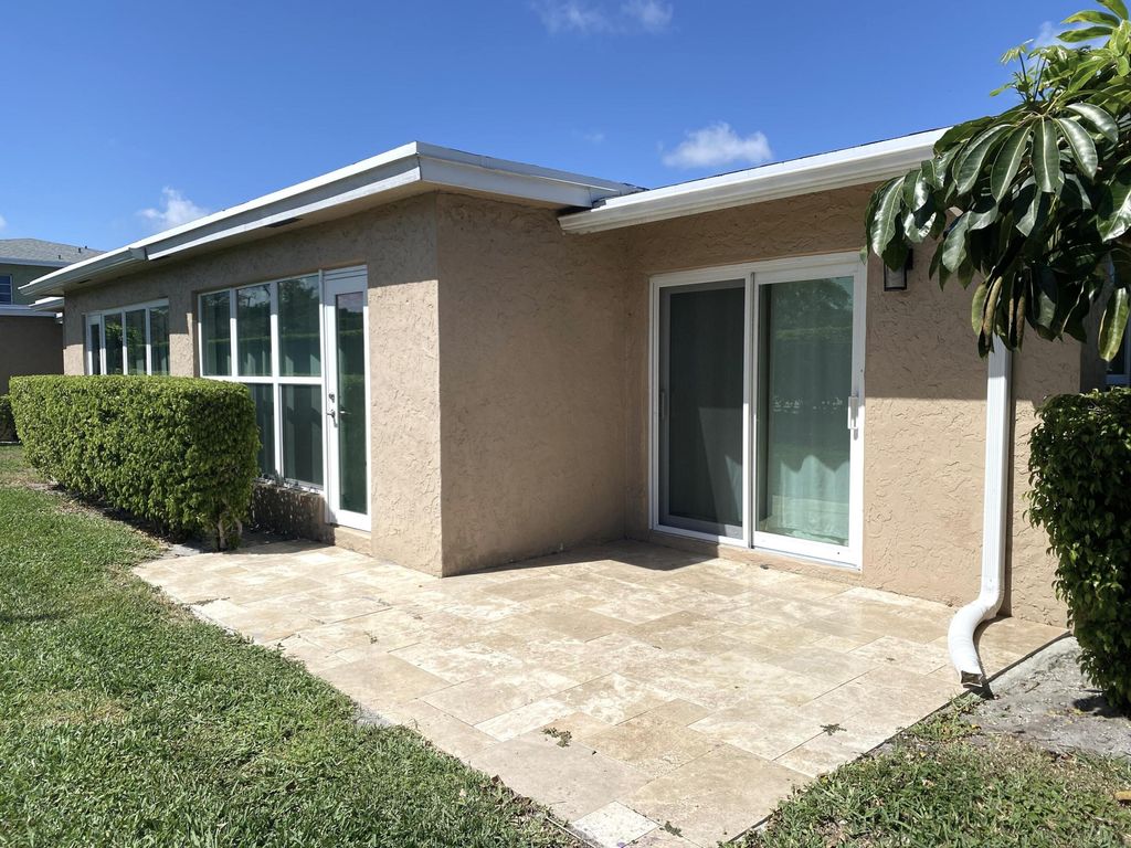 Photo of 2450 Black Olive Blvd #A, Delray Beach, FL 33445 (MLS # B26000435)