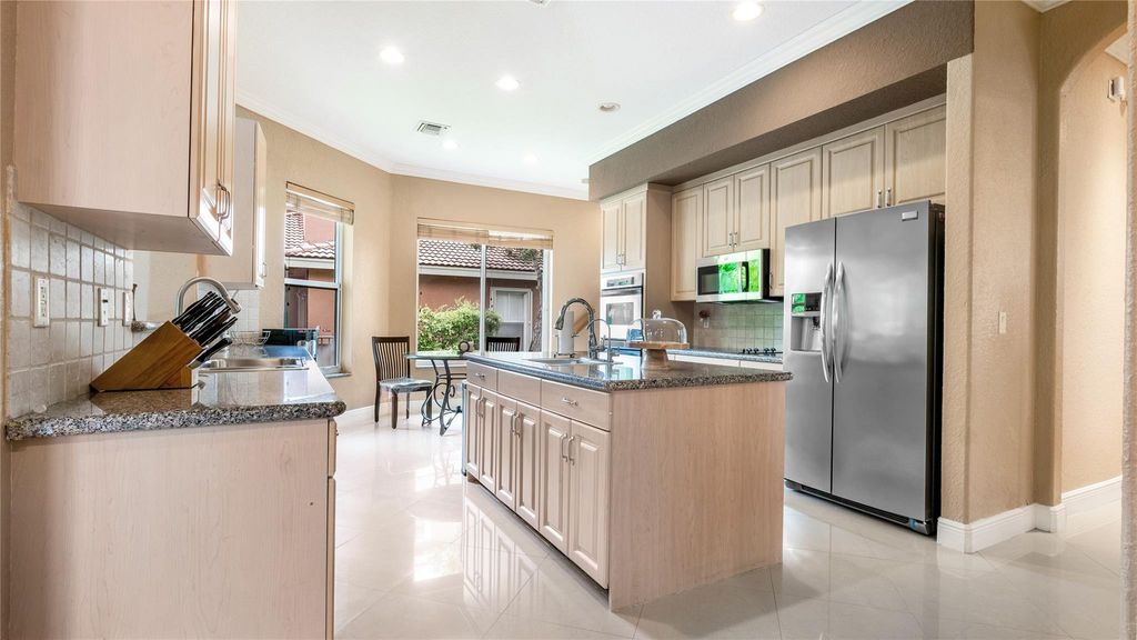 Photo of 10982 NW 70th Court, Parkland, FL 33076 (MLS # B26023373)