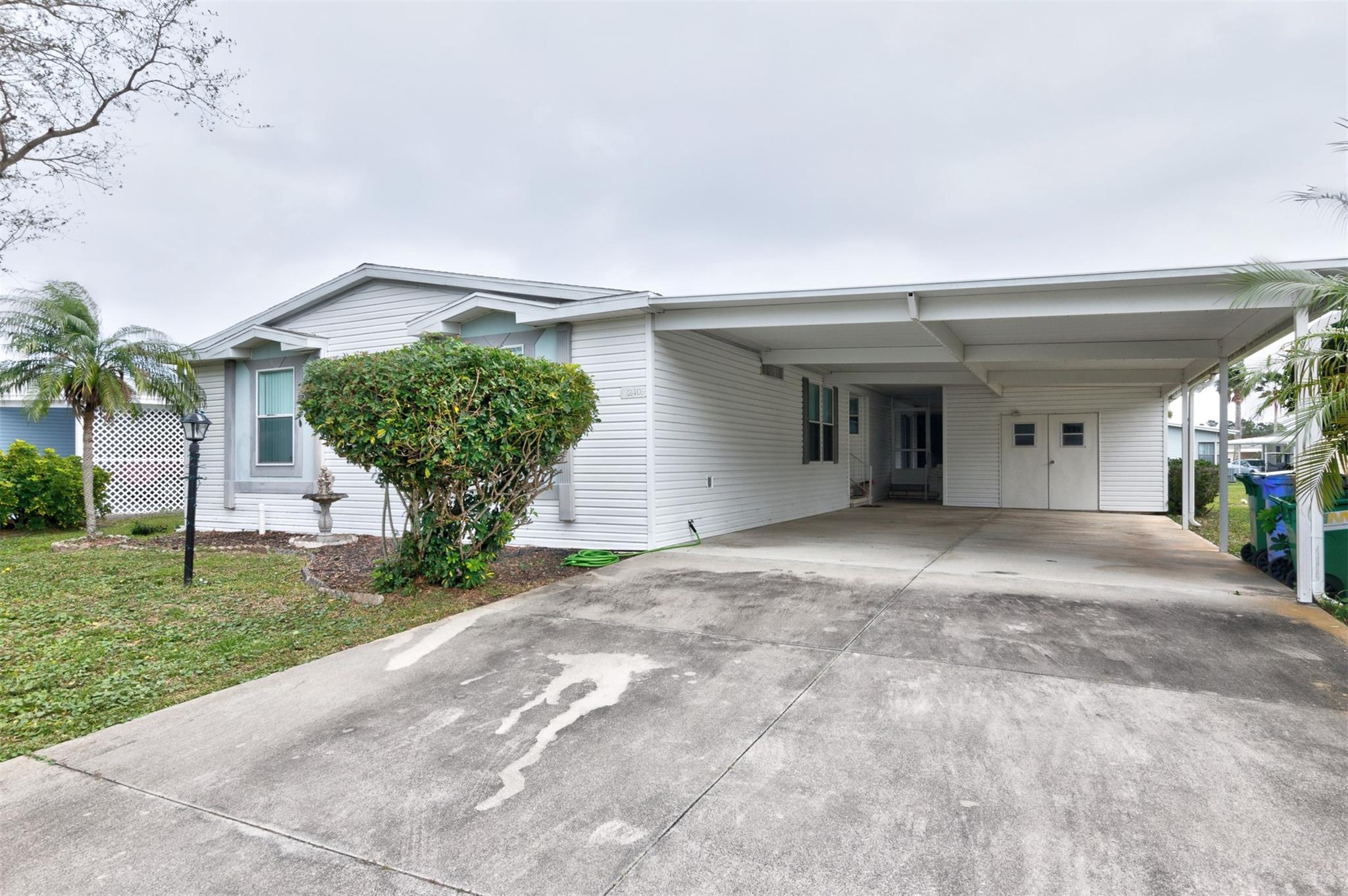 3/2 with double wide Covered carport. Big home for the right people. Lovely location on Kelly Dr. in a 55+ Community (Park Place) in Sebastian Florida. You will love this setting. near shopping and a quick trip to the beach. Big open Kitchen with breakfast nook on one end and formal dining on the other. Large Master, with 2 guest bedrooms. Recently shampooed carpet makes it look new.. ($375 per year/$95 landfill per year)