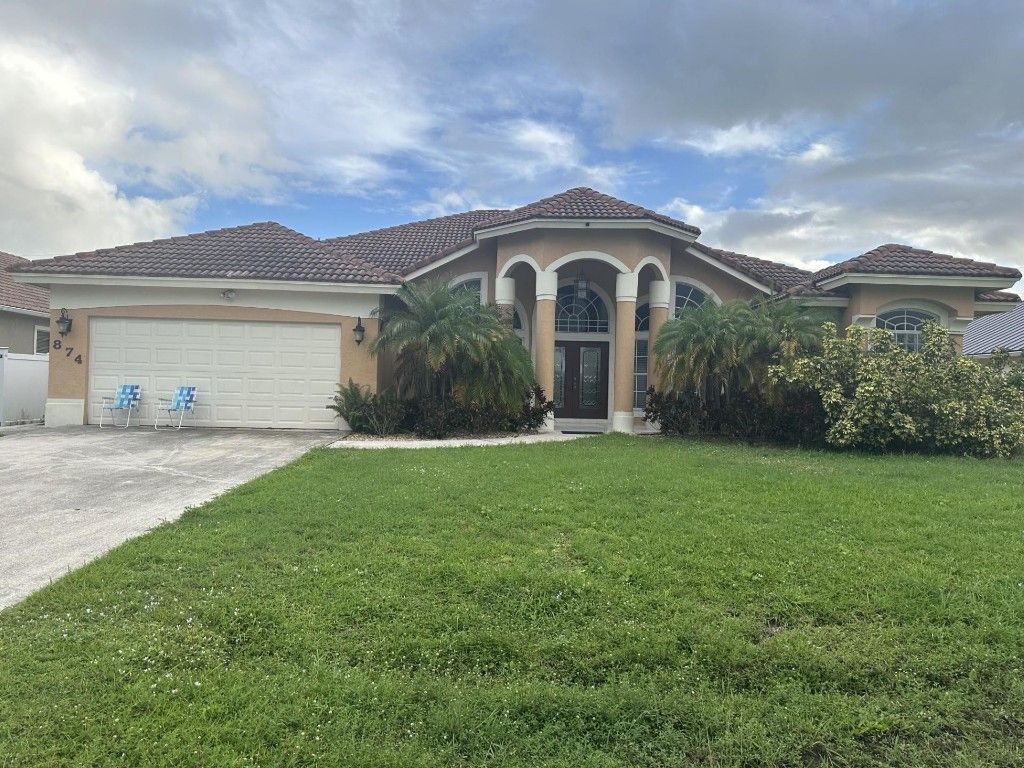 Photo of 874 SW Mccracken Avenue, Port Saint Lucie, FL 34953 (MLS # F10530543)