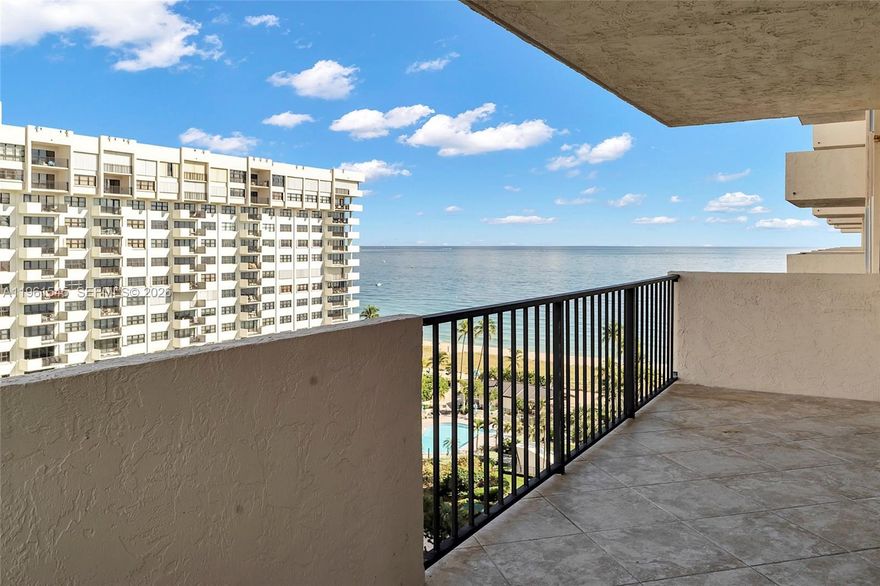 Ideal as a full-time residence or the perfect coastal getaway, this beautifully positioned 2-bedroom, 2.5-bath home at Sea Ranch Club delivers space, comfort, and truly stunning views.  Perched high above the shoreline, the residence features an expansive wraparound balcony showcasing sweeping, unobstructed views of the ocean, Intracoastal, and city skyline—offering a spectacular backdrop from sunrise to sunset.  Inside, volume ceilings and floor-to-ceiling impact windows fill the space with natural light, creating an open and inviting atmosphere. Recent upgrades include a new A/C system (2023), newer water heater (2023), and the convenience of in-unit laundry. The kitchen features custom cabinetry and flows seamlessly into the bright living area,  ideal for both everyday living and entertaining.  Set within 14 acres of private beachfront in Lauderdale-by-the-Sea, Sea Ranch Club offers a true resort-style lifestyle. Amenities include multiple heated pools, beachfront cabanas and gazebos, outdoor grilling areas, tennis and pickleball courts, a fitness center, sauna, library, and even a private snorkeling reef. Residents also enjoy two dog parks, a mini golf area, car wash station, assigned covered parking, and 24/7 security.  Conveniently located just steps from Publix, dining, and boutique shopping, this residence combines luxury living with everyday convenience.