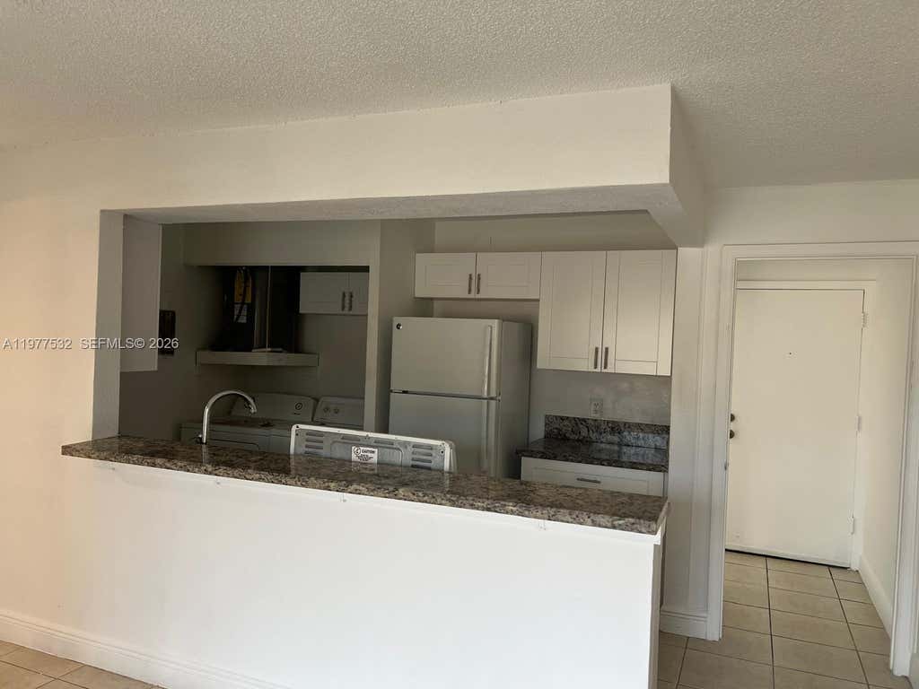 Photo of 4435 Treehouse Lane #27 H, Tamarac, FL 33319 (MLS # A11977532)