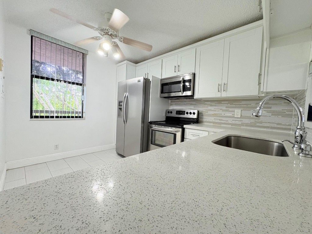 Photo of 3150 NW 42nd Avenue #E402, Coconut Creek, FL 33066 (MLS # F10471415)