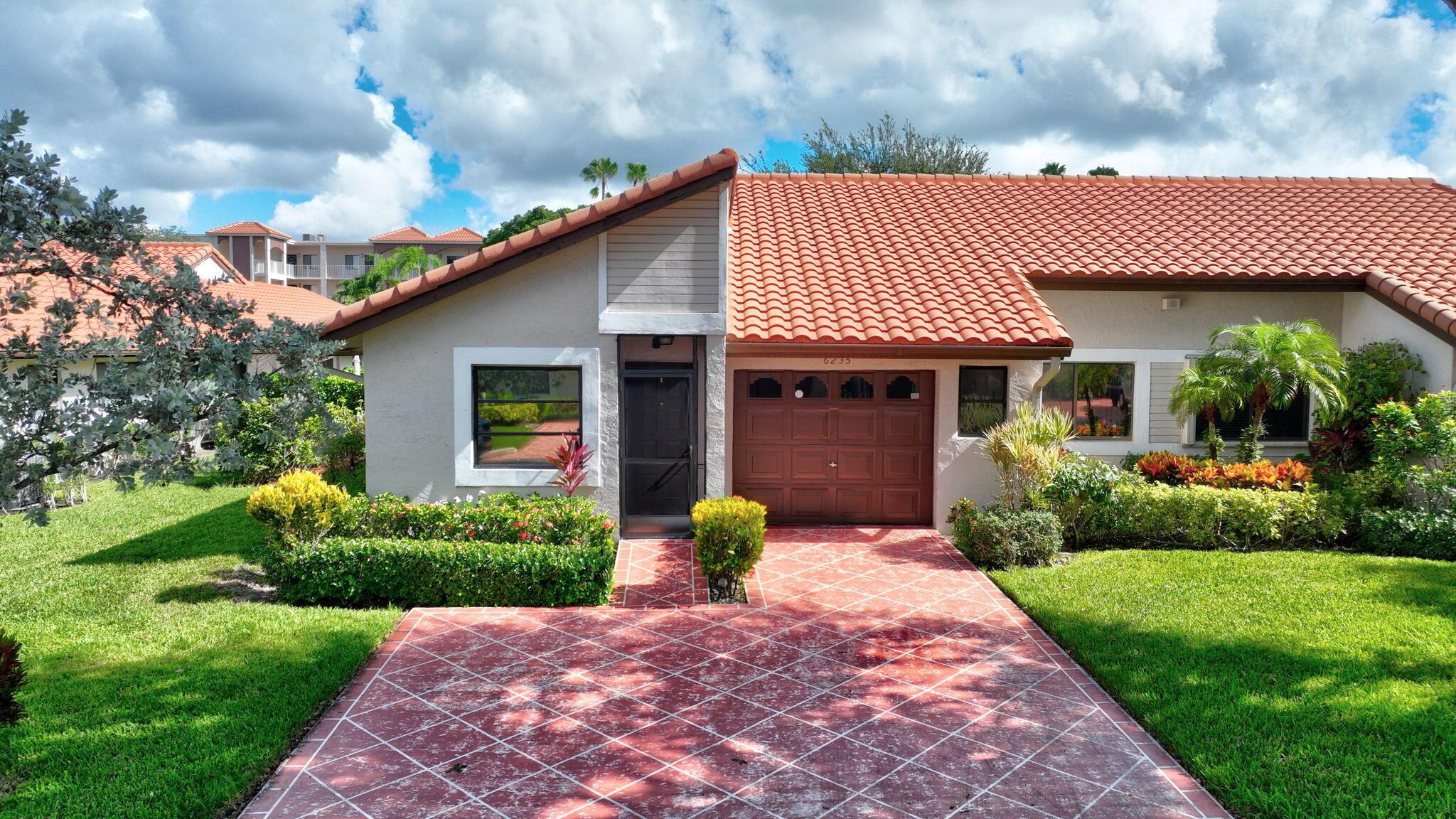 Discover this 2 bedroom, 2 bath corner villa tucked away in one of Delray Beach's most desirable active communities. Bright and inviting, this home features an open floor plan, abundant natural light, and a private enclosed patio perfect for relaxing. Wood and tile flooring throughout, renovated-open kitchen, oversized bedrooms with plenty of closet space. Spacious laundry room and attached 1 car garage with additional storage space.