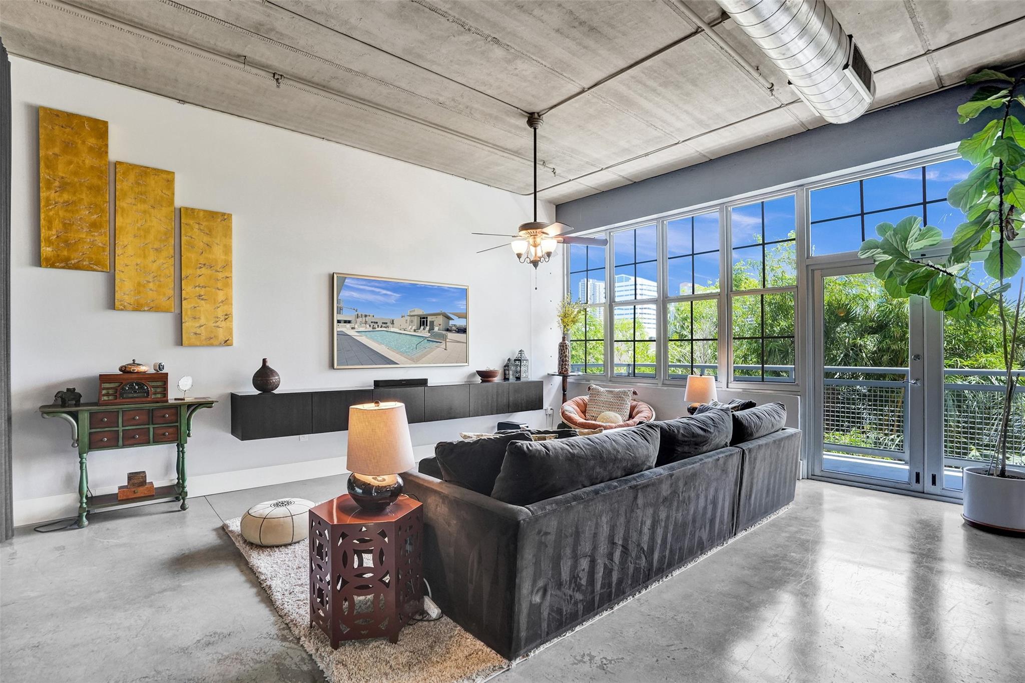 What an incredible location coupled with one of the most unique communities in Fort Lauderdale. Avenue Lofts is just that, cool and hip living space that is located steps to the best Downtown Fort Lauderdale has to offer. Great view of city skyline and 12+ foot high ceilings, this place screams cool. Polished concrete floors and exposed ceilings give the true loft feel. Great amenities include secured parking, rooftop pool and BBQ. state of the art fitness room rounds out this buildings great amenities. Walking distance to the Brighline and the soon to be FAT VILLAGE. Min 675 credit score -- Can be leased FURNISHED. TESLA charging station available in your private assigned parking spot
