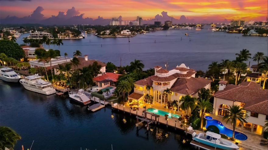 Located on one of Rio Vista’s finest isles! Uniquely offering one of the best wide open intracoastal views to the front of the residence plus 100 feet of deepwater frontage on 120 ft canal.  Almost every room features a view!  Totaling almost 11,000 sf this extraordinary custom residence showcases 3 levels of immaculately presented luxury living. Easy flowing formal & casual entertaining areas surround the gourmet kitchen.  1st level includes formal dining, fireplace, media room, waterfacing office & large VIP suite.  Elevator access to 2nd level ultra luxurious primary wing, sitting area & private balcony, large additional VIP suite, all expansive bedroom suites. 3rd level Club Room (or 6th bedroom) offers double balconies, amazing views & elevator access. Must be seen to be appreciated!