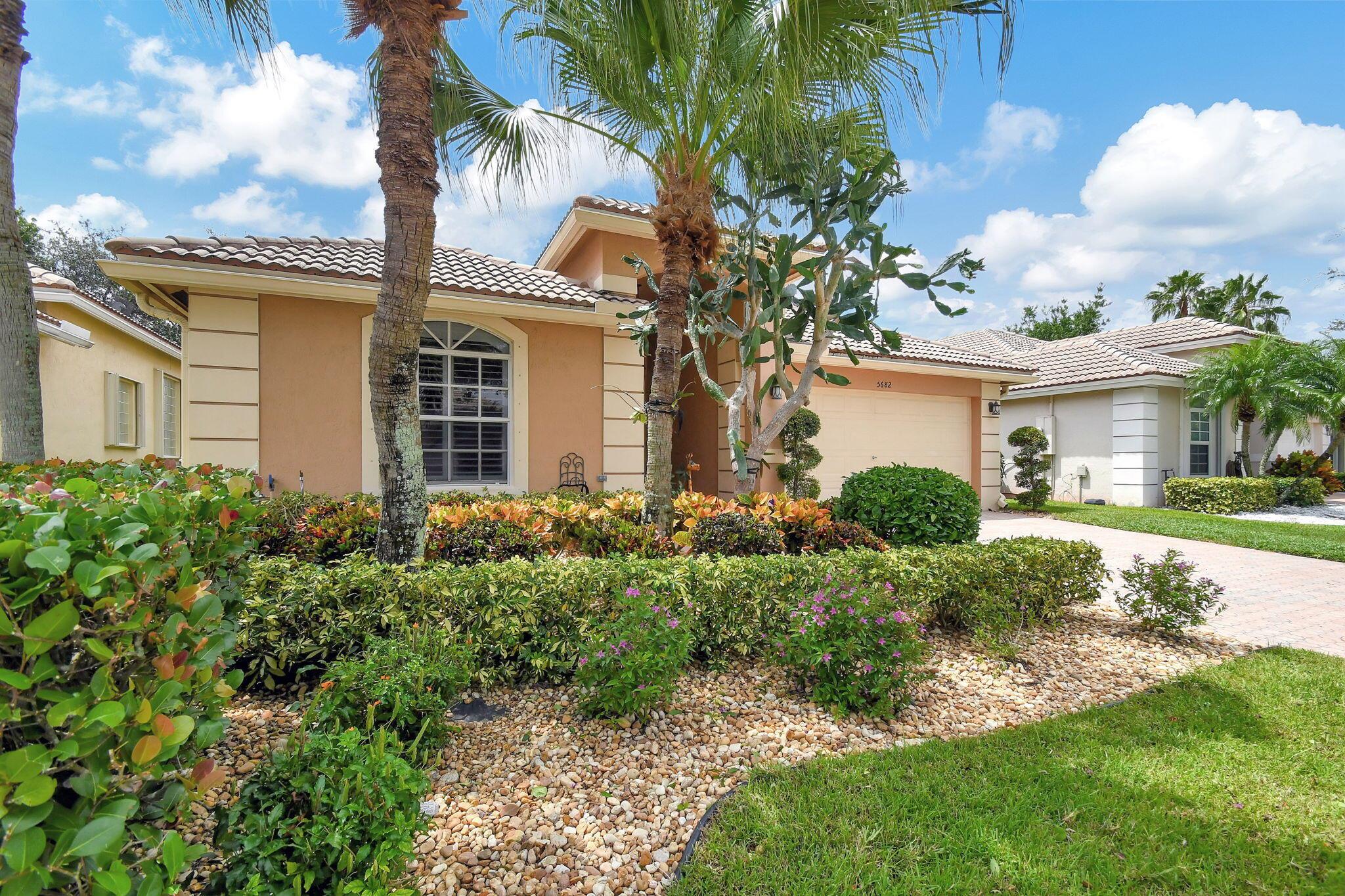 THIS IS THE HOME YOU HAVE BEEN SEARCHING FOR! From the minute you enter this special 3 bdr 2/1/2 bath home with its beautiful pool and outdoor kitchen, you will be wowed. THIS HOME HAS IT ALL. Spacious open layout. Prinary bedroom has renovated en suite bath with separate showerwith WIC. Open kitchen with S/S appliances, wine cooler & granite counters, Low HOA. Golf courses on premises. Membership is optional. Tennis, pickleball, fitness center and more,