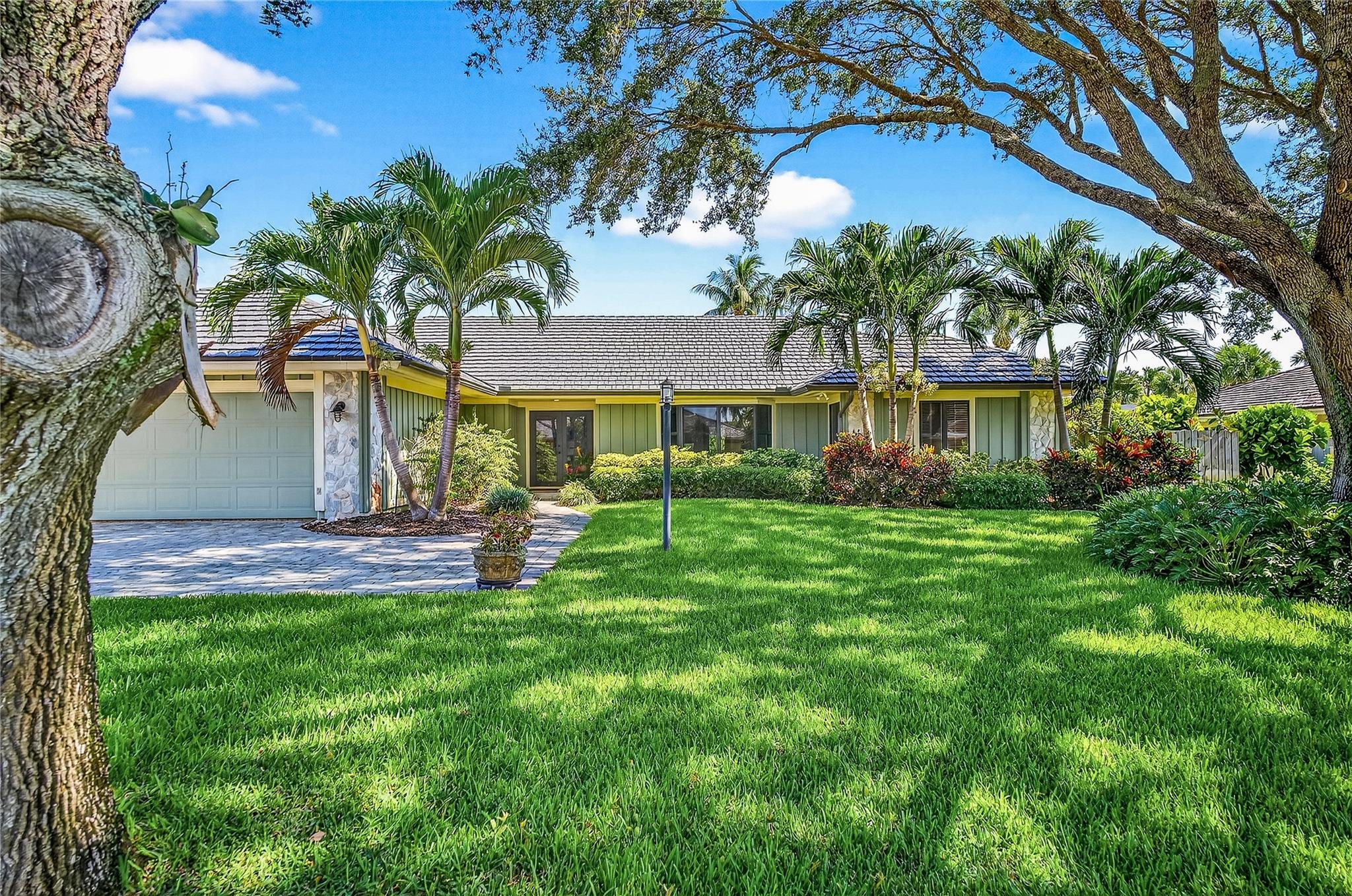 East of A1A this beachside home lies in beautiful Seagrove, A special neighborhood safe for young families, snowbirds, and everyone in between. Guard protected 24-7. Two private accesses mean a short distance to beach. All maintained with strict attention to critical items: 2024 electrical panel, 2019 metal roof, impact windows 2016, Spectacular heated lap pool, and spa with travertine decking 2020, 2019 water heater. - Open kitchen to Family room , granite counters, newer SS appliances, wine cooler, wet bar in great room. Vaulted T&G ceiling complete with Fireplace. Really, all the features you are looking for! Indoor space offers split floor plan, wide open great room. if you enjoy wildlife you can expect beautiful birds all year with special tiny owls in season. Take a Closer Look!