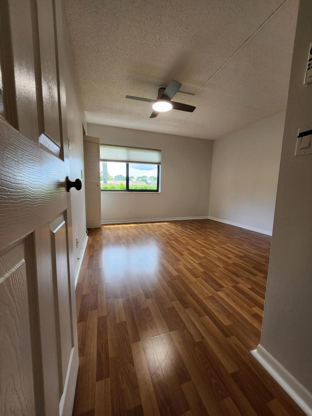 Photo of 311 KNOTTY PINE Circle #A-1, Greenacres, FL 33463 (MLS # B26072397)