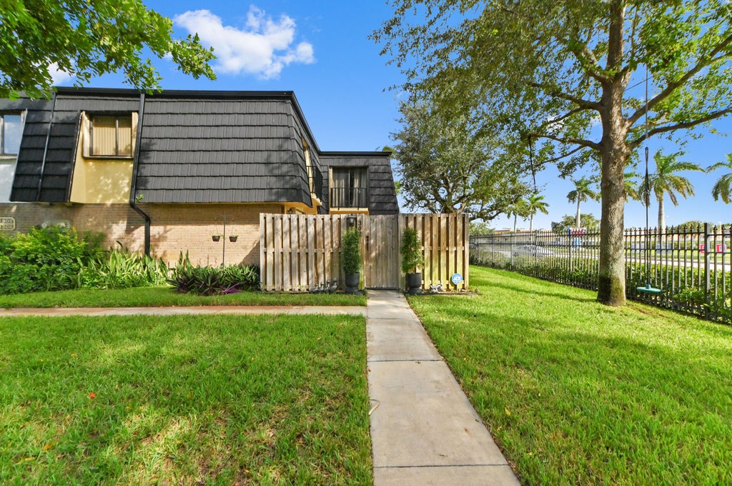 Photo of 302 Woodland Road, Palm Springs, FL 33461 (MLS # B26094142)