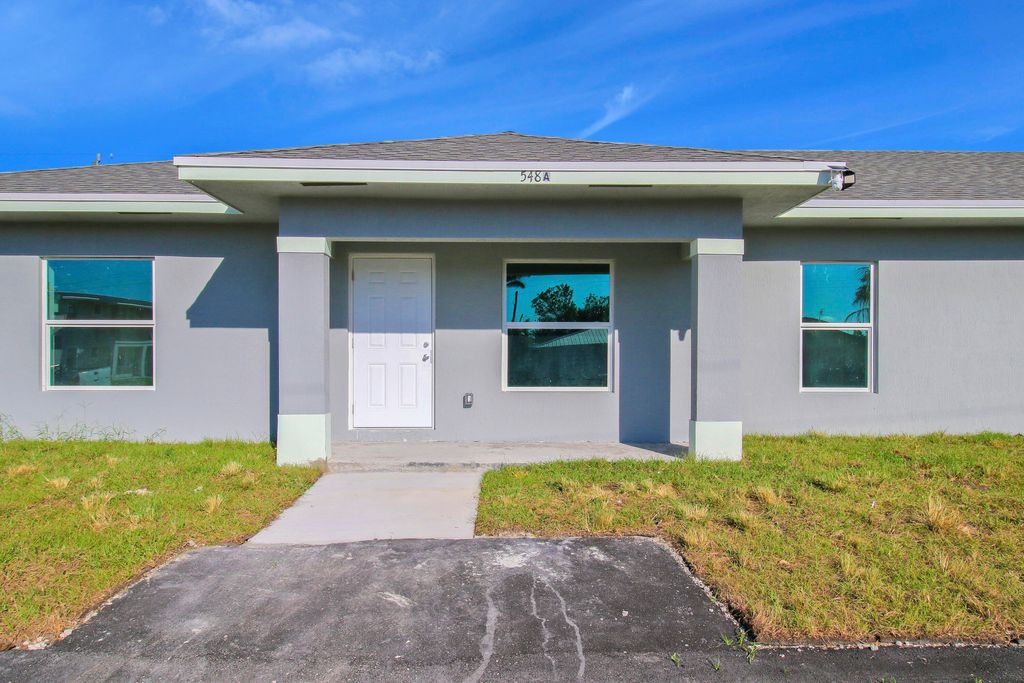 Photo of 548 SW 5th Street, Belle Glade, FL 33430 (MLS # R11152124)