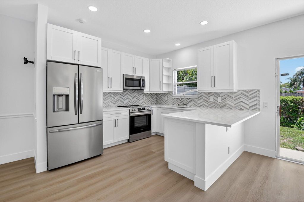 Photo of 245 Leland Lane, Greenacres, FL 33463 (MLS # R11101135)