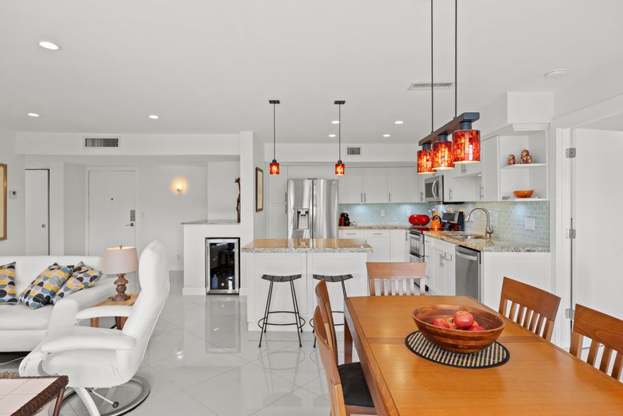 TURNKEY and tastefully renovated, this bright 2-bedroom residence offers modern living in the desirable Fairways Riviera of Hallandale Beach. The fully updated interior features an open-concept kitchen with stainless steel appliances, granite countertops, and sleek tile flooring throughout. Designed with both style and comfort in mind, the unit offers spacious living areas, recessed lighting, and beautifully renovated bathrooms. Impact windows and sliding doors provide added security, energy efficiency, and peace of mind.  Enjoy a large tiled patio perfect for relaxing or entertaining, overlooking lush greenery that creates a private and tranquil setting. The well-maintained building offers great amenities including a heated pool, gym, and more...  Maintenance includes cable, internet, hot water, and additional services for convenient, worry-free living. Ideally located just minutes from the beach, Gulfstream Park, Aventura Mall, shopping, dining, and major highways.