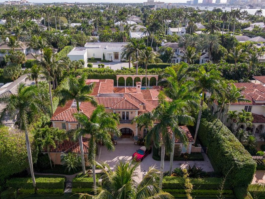 Elegant Mediterranean residence nestled in the beautiful Phipps Estates built by Dan Swanson. The only street in Palm Beach with a gated entrance. This home features marble staircase, magnificent 2-story marble foyer, exquisitely detailed 15' ceilings & architectural detail throughout. First floor master suite with his and her bathrooms, 4 guest suites, gourmet kitchen open to family room, covered outdoor dining terrace, Heated salt water pool, elevator, Entertainment bar, full house generator and a 3 car garage all on a prime North exposure.