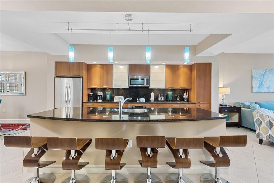 Nestled in a boutique building of just 45 private residences, discover this elegantly large 2BR, 2.5BA condo plus den at Villas By The Sea. The spacious primary suite, boasting a king bed, walk-in closet, and luxurious en-suite w/ dual sinks, a separate shower & tub. The guest bedroom also offers an en-suite. Transform the den, equipped with a sleeper sofa, into an office, guest space or dining room. Features include 10' ceiling, impact windows, & a laundry room. Just across, find the exclusive Beach Club, gazing over the beach & Atlantic, w/ direct beach access. Enjoy cabanas by the pool, a full kitchen, BBQ, spa, and exercise room. Situated on Lauderdale by the Sea's iconic oceanfront street, experience an intimate living with dining, shopping, and entertainment merely footsteps away.