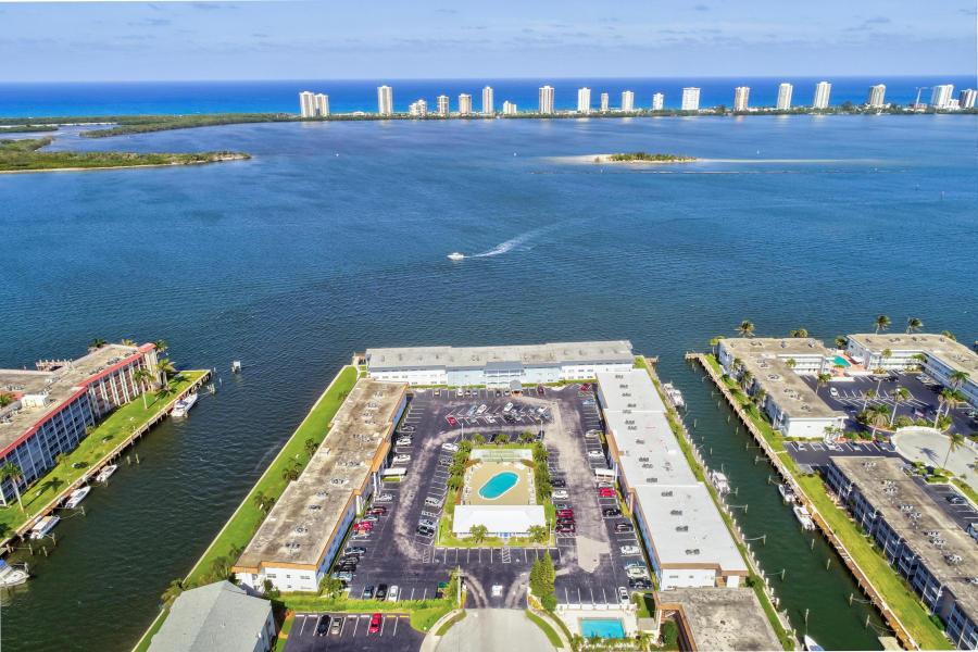 What a view! The closest to living on a cruise ship and staying on land! This adorable 3rd floor 1 bed 1 bath condo with an open floor plan is all about the views! Direct intracoastal waterway views overlooking Singer Island and Munyon Island. Spectacular sunrises and moonrises! Shore Club is an active 55+ intracoastal waterfornt community ideally located in NPB. Conveniently located close to fabulous restaurants and shopping, beautiful beaches and world class golf. MIns to PBIA.
