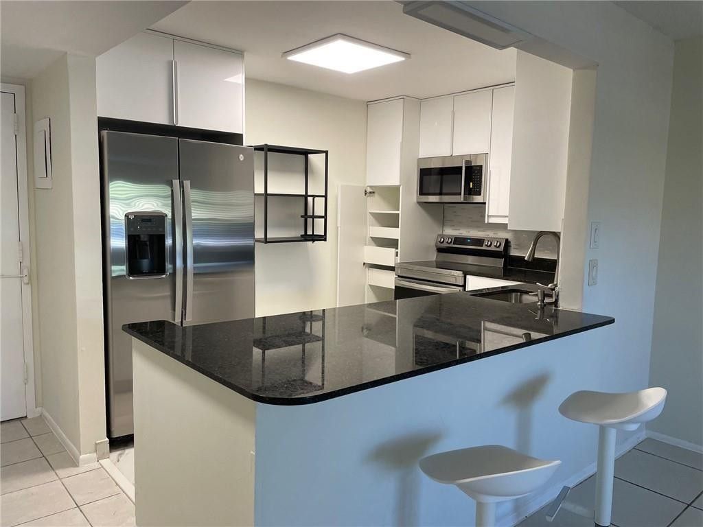 Photo of 4334 NW 9th Avenue #7-1E, Pompano Beach, FL 33064 (MLS # F10513412)