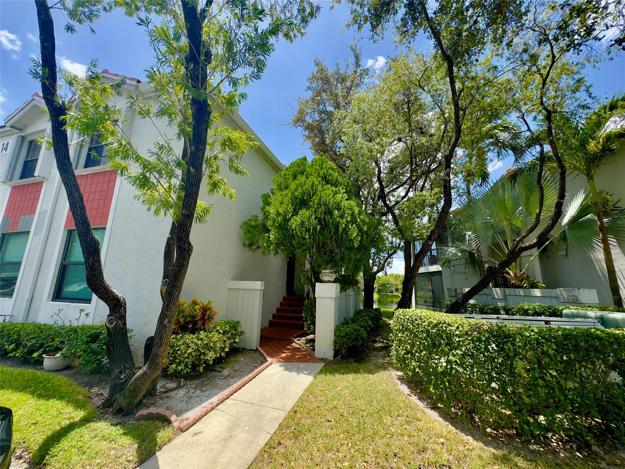 Check out this 3-bedroom, 2-bath corner unit overlooking the lake in the gated Pierpointe community with 24/7 security. You will love the split floor plan, beautiful wood floors, and plantation shutters throughout. The open kitchen features granite countertops and stainless steel appliances, perfect for cooking and hanging out. Step outside to a big patio with peaceful lake views — great for relaxing or entertaining. Extras include a tankless water heater, accordion shutters, and washer/dryer inside. The roof was replaced in 2024, and the community is getting a fresh new look with paint, PVC fences, and updated signage. Plus, it’s super convenient — close to hospitals, shopping, A-rated schools, and easy highway access.