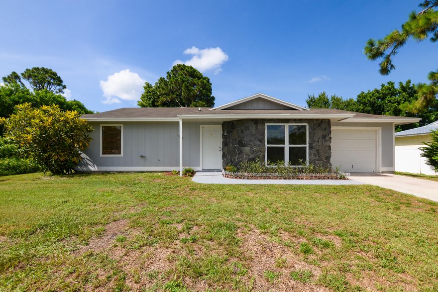 Bright and clean! Come see this completely remodeled two bedroom, two bathroom home that is conveniently located in a great neighborhood setting that is close to everything in Port St Lucie! Tons of natural light in every room. New vinyl flooring, fresh texture and paint, new vanities, sinks and toilets in both bathrooms, stainless steel appliances and new cabinets with butcher block countertops in the kitchen, updated electrical including switches, outlets, fans, lights, etc. Great backyard with an above ground pool.  Vacant lot next door. Competitively priced to sell quickly.