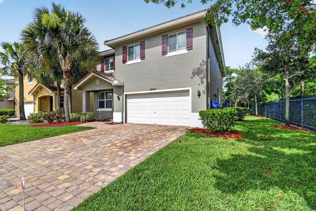 Photo of 5667 Caranday Palm Drive, Greenacres, FL 33463 (MLS # B26048644)
