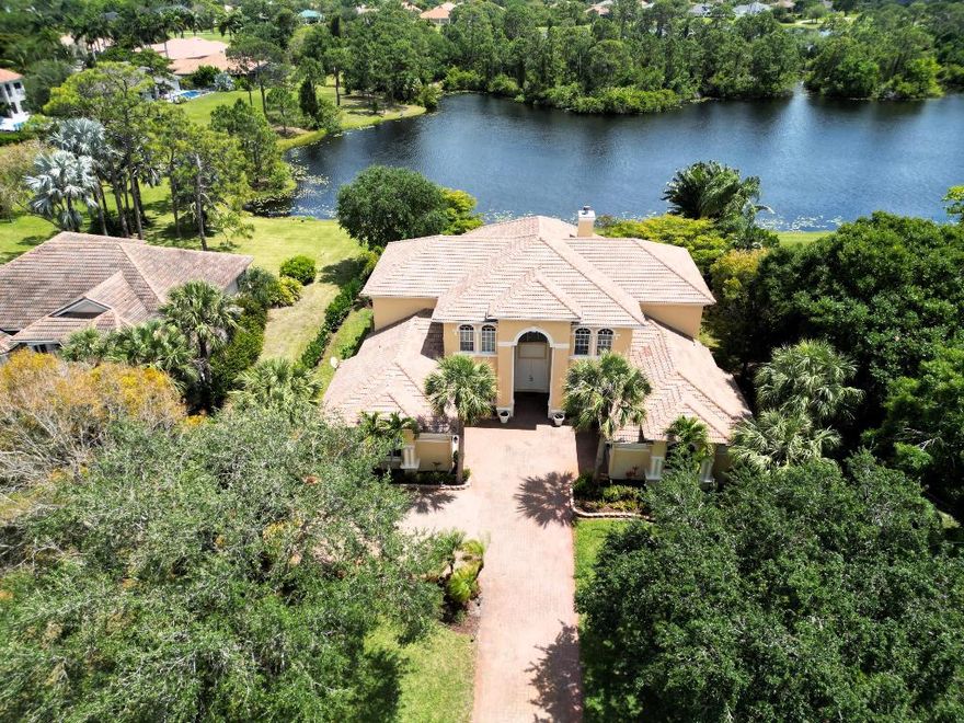 Imagine waking up to tranquil lake views, sipping coffee beside your resort-style pool, and retreating each night to a spa-like primary suite, all in the guard gated community of Cobblestone. This 5BR/6BA, 4-car garage home offers polished marble floors, newer appliances, Culligan water system, and fresh interior/exterior paint ('24). Major upgrades include new 5-ton A/C ('24), new 1-ton A/Cs and water heaters ('25). The upstairs loft with full bath provides flexible space for guests, office, or play. Zoned for ''A''-rated schools and just minutes to I-95, Turnpike, golf, and beaches. Cobblestone is a gated community known for oversized lots, lush preserves, optional golf memberships, and a relaxed, friendly vibe. Just minutes to I-95 and the Turnpike and ''A'' rated Martin County schools.