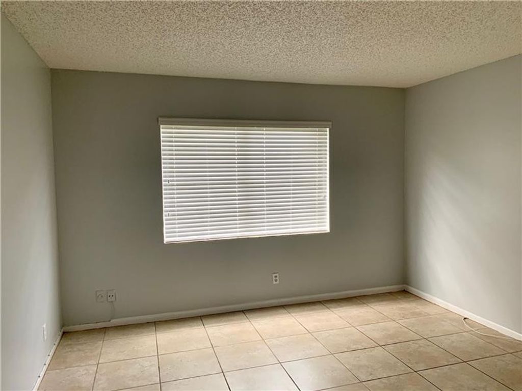 Photo of 2830 Riverside Drive #102, Coral Springs, FL 33065 (MLS # F10542874)