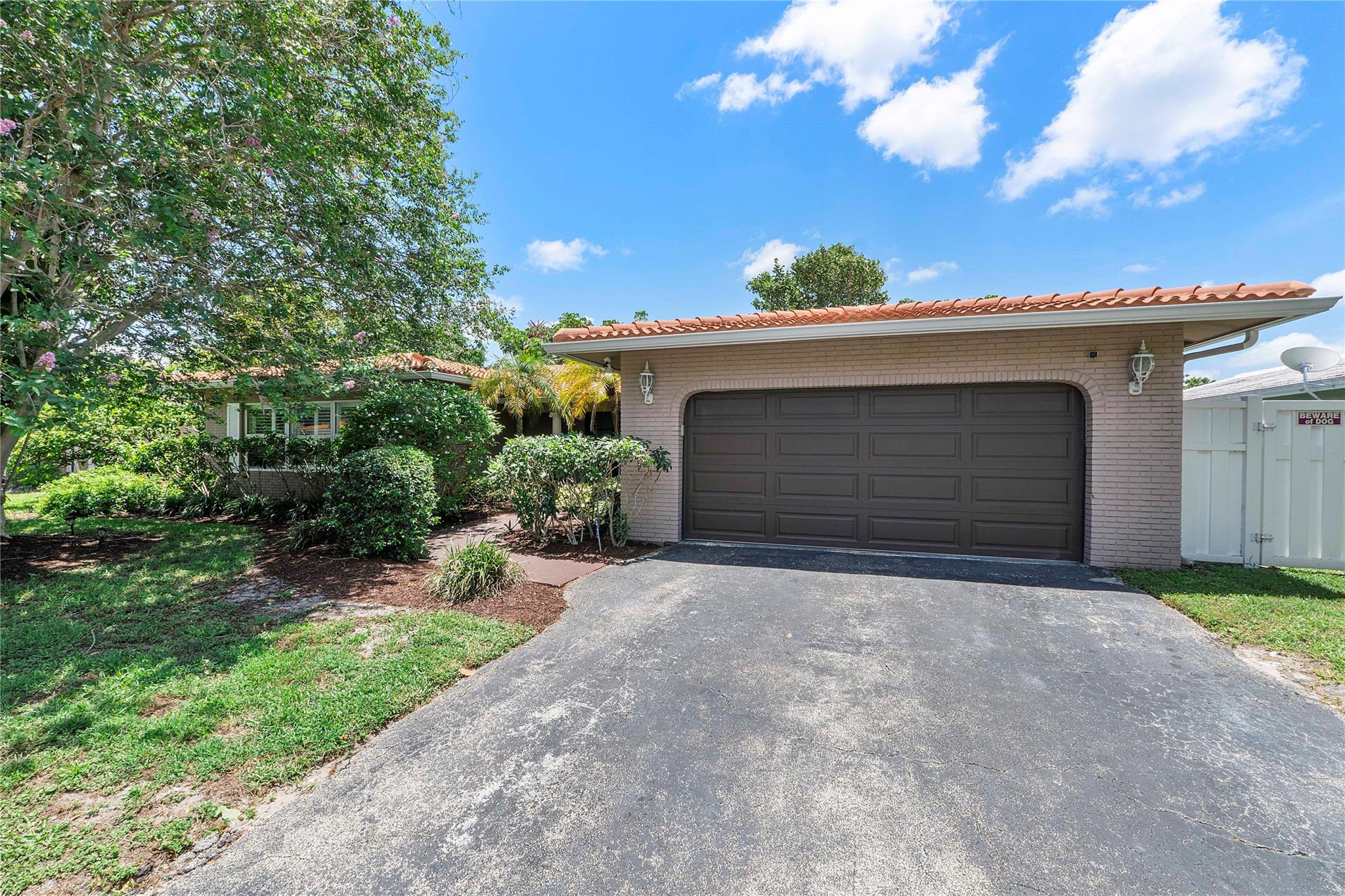This spacious 3 bedroom, 2-bath pool home offers the perfect blend of comfort, style. Situated on nearly a 1/4 acre. No HOA , Newer PVC fence, this home provides privacy and room to relax or entertain. Crown molding adds warmth and style. Split floor plan with generous living spaces, including a sunken living room, Beautiful plantation shutters throughout. The updated kitchen and bathrooms were renovated in 2018, Hurricane-impact doors and windows throughout. Newer barrel tile roof (2019). Step outside to your screened patio overlooking the sparkling Diamond Brite pool with updated coping, completed just 6 years ago. Additional upgrades include a 6-year-old air conditioning system, and a 3-year-old tankless hot water heater.