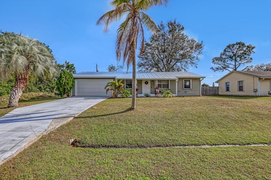 2 BD 2 BA Plus Florida Room & 2 Car Garage. New Roof (2024). Updates completed in 2023 include: A/C; Garage Door; Kitchen (granite countertops, cabinets, & SS appliances); Bathrooms (Complete); New Flooring throughout. Easy to Close Accordion Shutters. All sizes are approximate. **Draperies Are Not Included**