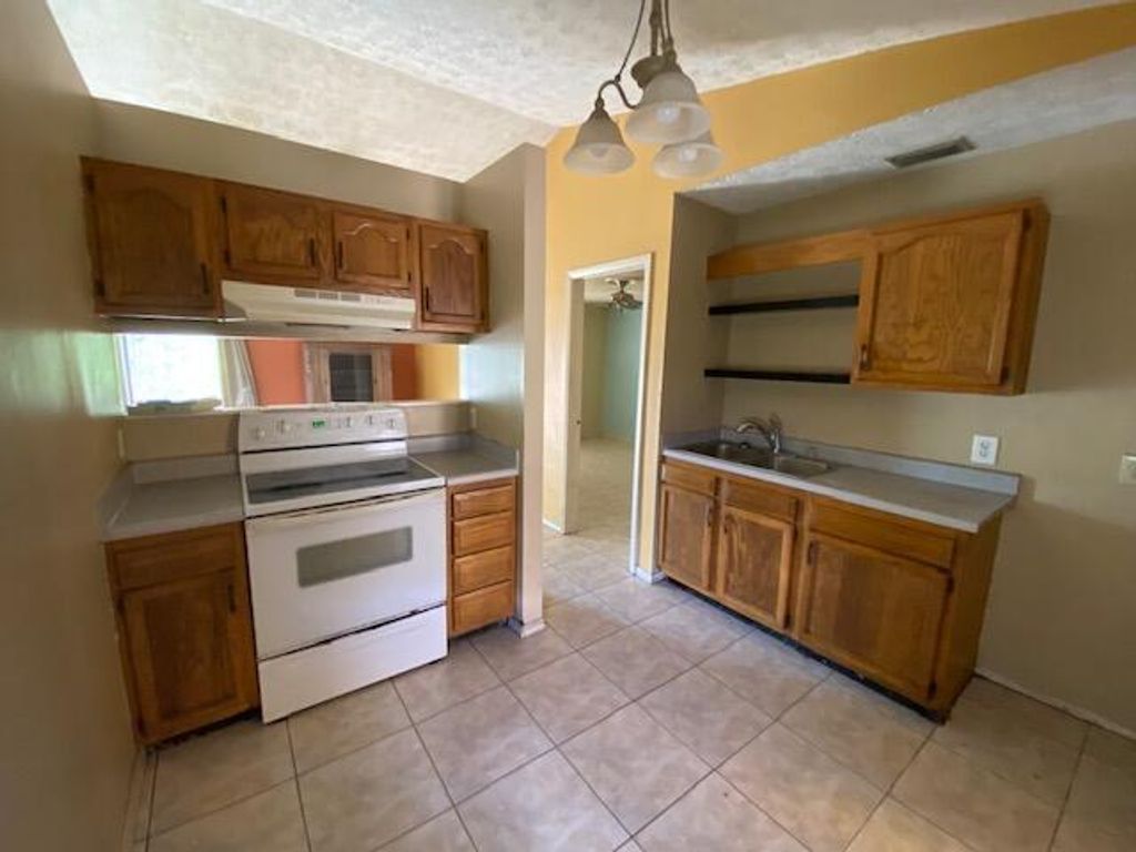 Photo of 3512 SW Vollmer Street, Port St Lucie, FL 34953 (MLS # R10873570)