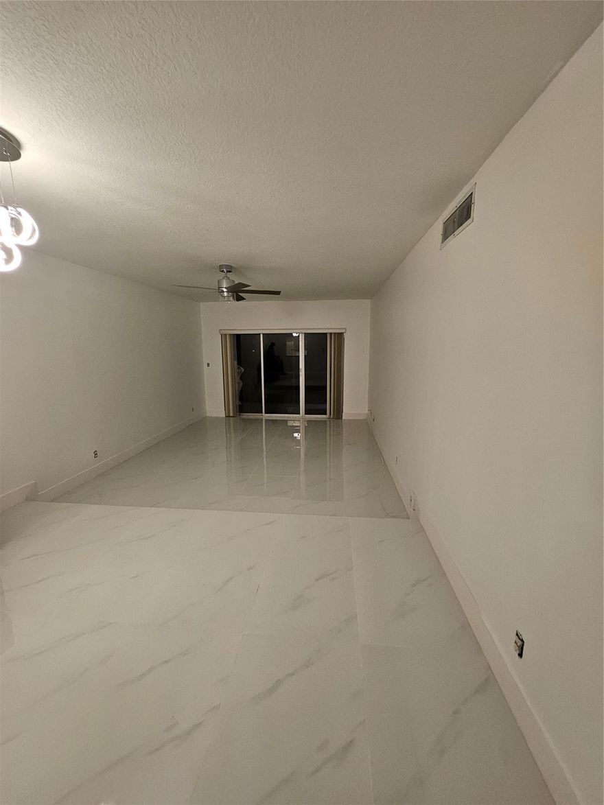 Check out this spacious 2 bed, 2 bath in the heart of Coral Springs. Excellent location for families of all ages. Directly across from Fire and Police Departments. Coral Springs Center for the Arts, Museum and park complex are located close by. Easy access to Hospital and restaurants within vicinity. Great schools within the zone. Property is well maintained. NEW roof 2023, NEW elevator 2023, Parking lot re-paved 2023. Pool and open back courtyard. Designated car space with additional parking. The unit is sheltered from the elements as a middle unit with storm shutters. Quiet with no overhead neighbors. Large master bedroom w/door to balcony. Ample closet space throughout. Washer/Dryer in unit. Open kitchen looking out into dining and living space.