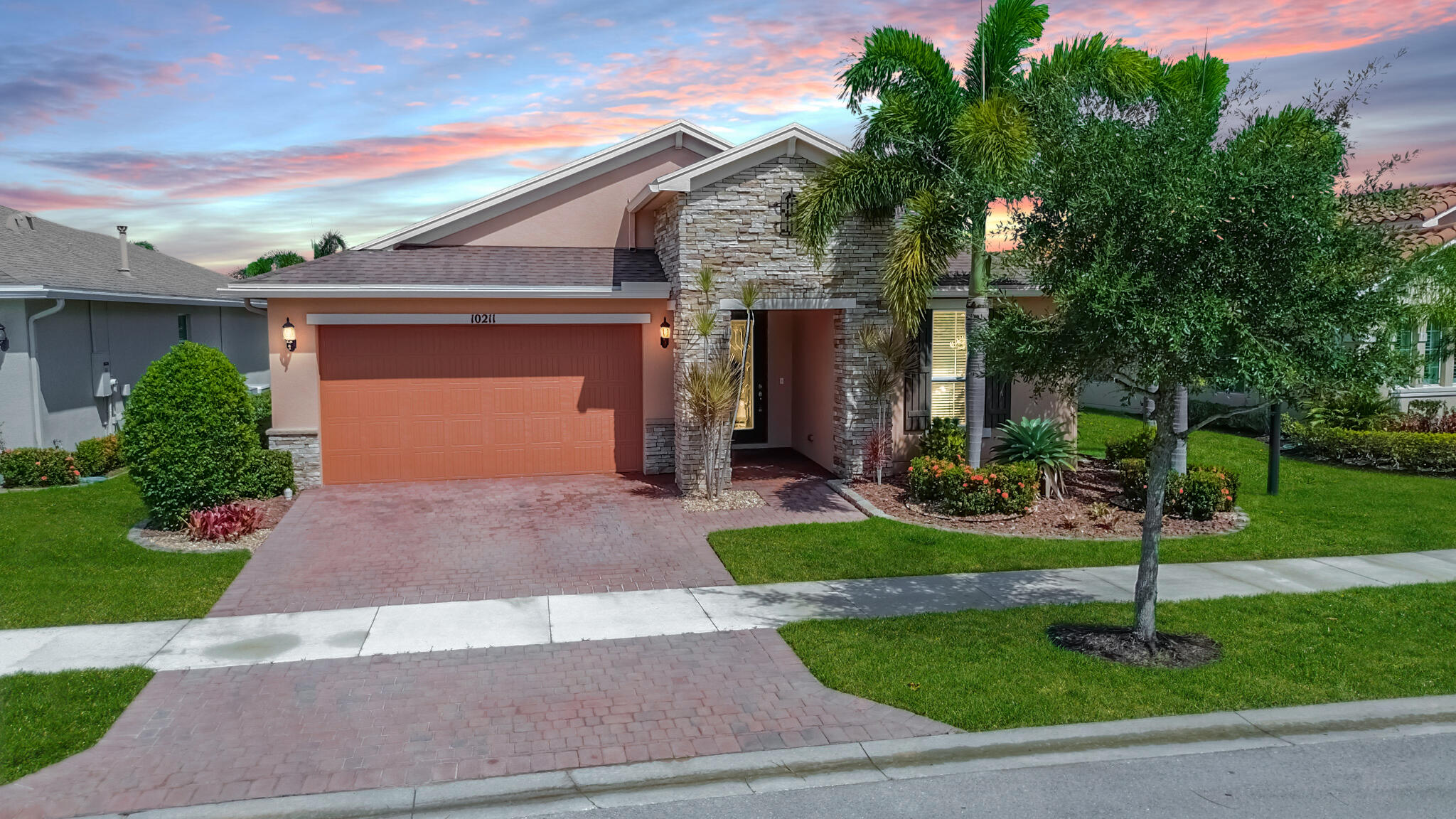 Live like a VIP in Vitalia! This show-stopping 2/2/2 + den home stuns with wide lake views and top-tier upgrades. Tray ceilings, French doors, custom shades, and tile floors bring the glam. The chef's kitchen wows with granite, 42'' wood cabinets with pullouts, double oven, cooktop, and sleek stainless appliances. Open layout, front-load washer/dryer, and high-impact glass throughout for style and peace of mind. Step out to your huge covered, screened lanai and soak in the view. Vitalia delivers with resort-style amenities--sparkling pool, pickleball, fitness center, endless clubs, and more. Gated, active 55+ community and absolutely fabulous!