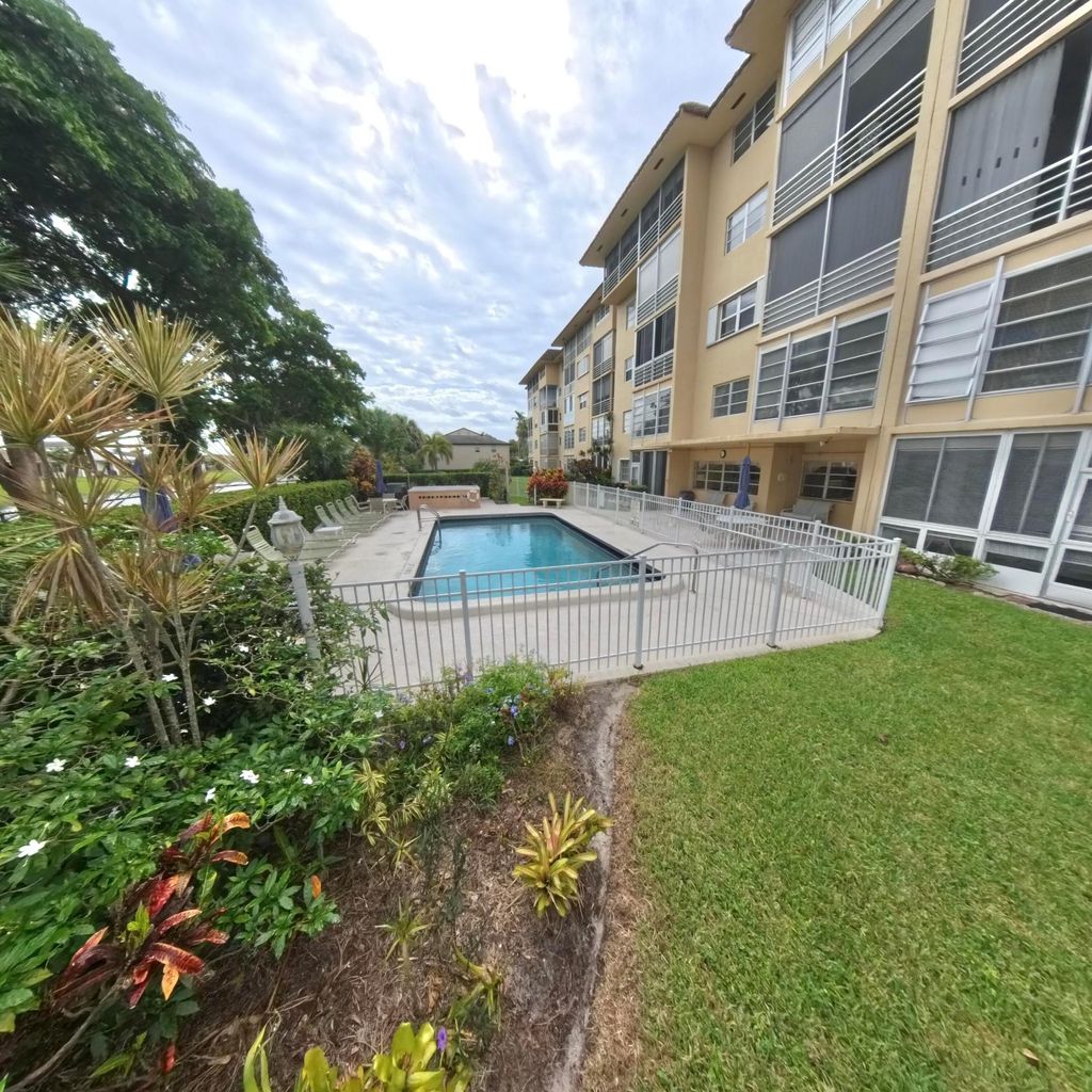 Photo of 4100 Crystal Lake Dr #209, Pompano Beach, FL 33064 (MLS # B26000850)