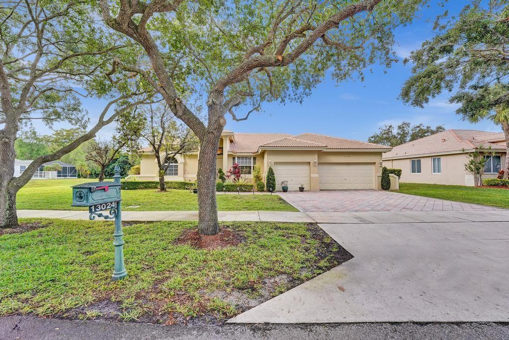 Welcome to an exquisite sanctuary nestled in the prestigious gated community of Country Glen. This Windsor Model boasts a desirable split bedroom floorplan, high vaulted ceilings, new wood-look tile flooring, remodeled open kitchen, new contemporary fans & lighting fixtures, impact windows & doors throughout and a 3-car garage with mini-split AC. Step outside to your private oasis, featuring a newly-diamondbrited pool with a travertine deck, complemented by a relaxing screen porch for optimal outdoor living. The over-sized waterfront lot offers tranquil views & complete privacy. The exclusive 24 hour guard- gated community features tennis, basketball, walking paths, a playground & volleyball court. All of this on top of the A-rated Cooper City schools makes this a can’t miss property!