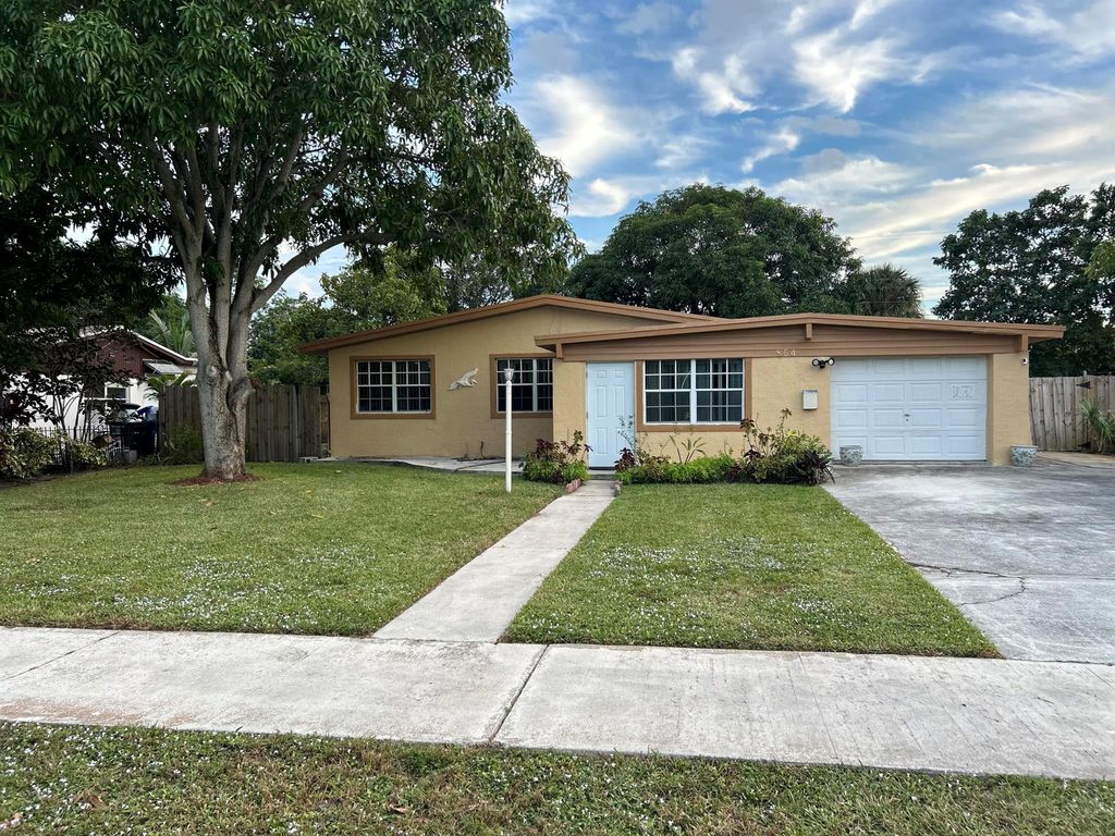 Photo of 854 W Kalmia Drive, Lake Park, FL 33403 (MLS # R11043933)
