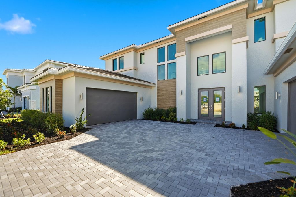 Photo of 7738 Longchamp Lane, Lake Worth, FL 33449 (MLS # B26033003)