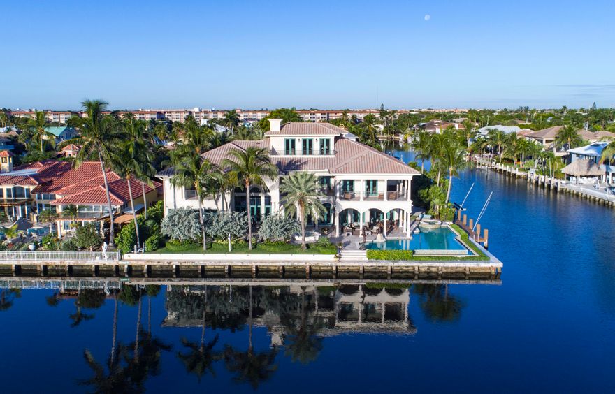 Prestigious Three Story Gated Intracoastal Point Lot Mega Mansion, 12,724 t sq ft, Smart Home, Lutron System, Crestron System, 272 Feet of Waterfrontage, a Yachtsmans Paradise. Elevator, fireplace, magnificent library, amazing clubroom/home theater, 3rd floor exercise room, impact glass, Chef's gourmet kitchen, whole house 100 kw generator, master suite with panoramic views, sitting room and his and her marble spa baths & wardrobes, salt water aquarium, resort style pool and spa. This Prestigious Gated Intracoastal Point Lot Estate has the finest outdoor living one could imagine with a summer kitchen, dockage galore and outdoor entertaining. Brand New 15K Hurricane Rated Boat Lift. 90 degree elevator boat lift.  Absolute Showplace! Supplement, renovation list & survey in Document section.