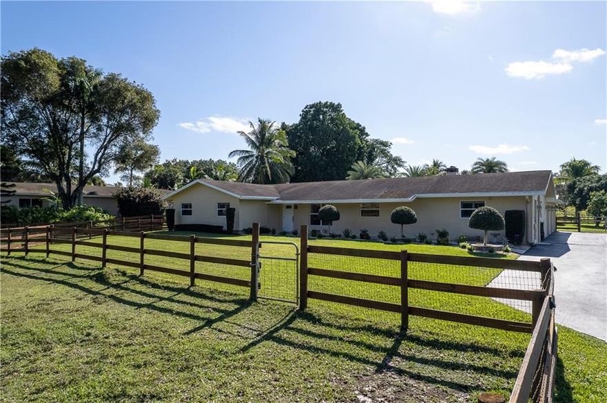 PICTURE-PERFECT ACRE POOL HOME METICULOUS INSIDE & OUT! WHITE QUARTZ KITCHEN, FARM SINK,UPDATED SS APPLIANCES! WOOD BURNING FIREPLACE! HUGE FAMILY ROOM, BARN DOOR!SPACIOUS MASTER,HIS/HERS ORGANIZED WALK-IN CLOSETS! UPDATED BATHS! PLANTATION SHUTTERS & ELEC BLINDS! NEW LAMINATE FLOORS. ALL IMPACT WINDOWS/DOORS! HI-EFF TRANE A/C, WIRED FOR GENERATOR! SIDE ENTRY 3 CAR GAR & HURRICANE DRS! SPARKLING SALT WATER POOL,NEW DIAMOND BRITE! LARGE COVERED PATIO, PVT SHOWER,MAGNIFICENT 56X24 BARN,TACK&FEED RMS! TWO 12X12 STALLS, GALVALUME METAL ROOF, AUTOMATIC WATERERS, CAMERA SYSTEM FOR HOUSE & BARN. MANICURED ACRE! MILES OF DAVIE'S AMAZING RECREATIONAL TRAIL SYSTEM, EXC. SCHOOLS INCL COUNTRY ISLES ELEM IN WESTON, FINE DINING, SHOPPING, HOUSES OF WORSHIP & HIGHWAY ACCESS MINUTES AWAY! HURRY-MUST SEE!! SPECS FOR BARN BUILT IN 2017:56 X 24 permitted wood barn built with concrete foundation and high-quality galvalume metal roof. 4 inch drop down for mats. Two 12x12 stalls with fans and individual paddocks in rear with access to pasture run. Dutch doors front and rear. Automatic waterers, camera system and Wi-Fi in barn. One 6x12 feed room and one 6x12 tack room Covered trailer parking. Concrete covered aisle. Electrical outlets. 3 board wood fencing with 2x4 safety wire. This is a beautiful barn however if you do not have horses it can be a huge workshop if desired.