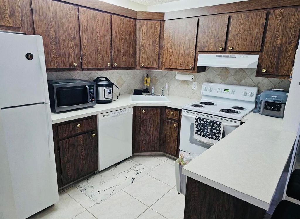 Photo of 443 Pine Glen Lane #C-2, Greenacres, FL 33463 (MLS # B26010763)