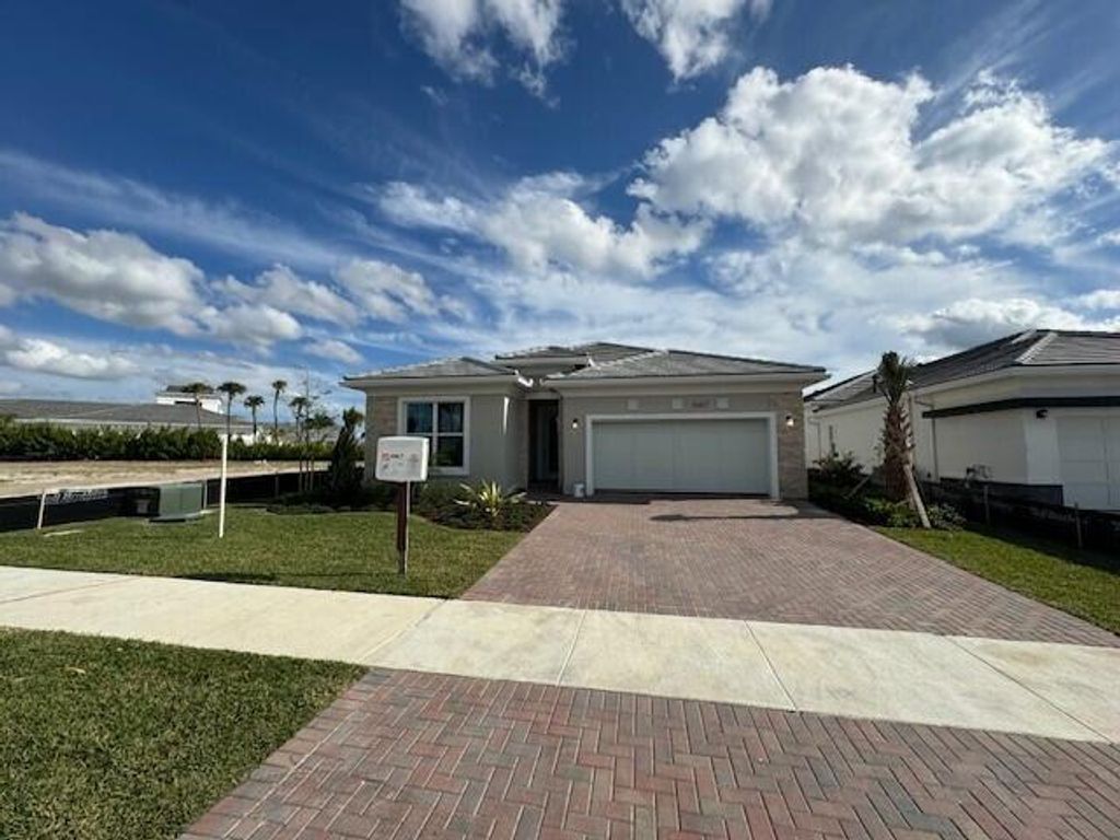 Photo of 10167 Driftwood Way, Palm Beach Gardens, FL 33412 (MLS # R10899777)