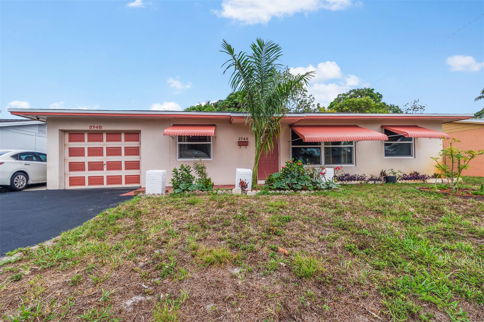 This charming 4 bedroom, 2 bath home offers plenty of space and potential! Enjoy the bright and airy Florida room, a 1-car garage, and a freshly redone driveway. The bathrooms have been tastefully updated in recent years, and the fully fenced yard is perfect for relaxing or entertaining under the shade of mature fruit trees. The kitchen is ready for your personal touch — update it to your style and make this home truly yours! **Dryer does not convey. All but 3 of the windows are impact. AC 2021. Owner prefers a long closing.
