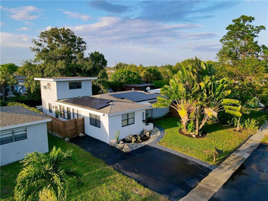 Welcome to one of the most unique homes on the market! Settled into a rapidly-appreciating Fort Lauderdale neighborhood, this spacious 4-bed, 2-bath + den has been totally updated from floors, to kitchen, to modernly-contrasted bathrooms. The kitchen has an eye-catching rustic-industrial look that you won't see anywhere else. The 4th bedroom is located upstairs within the extended back half of the house and provides a layout with ample privacy. Because this home sits on a large lot right across the street from a park, you can leave the blinds open all day for a bright feel with nothing but green space in sight. The home is also fully equipped with solar panels for an extremely reduced utility bill. AC replaced within the last couple years as well. Showings begin Saturday 5/13/23.