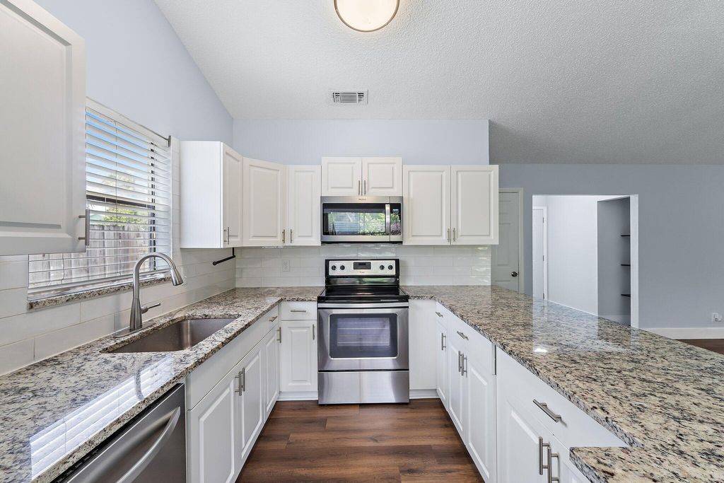 Photo of 141 Rosewood Circle, Jupiter, FL 33458 (MLS # B26019981)
