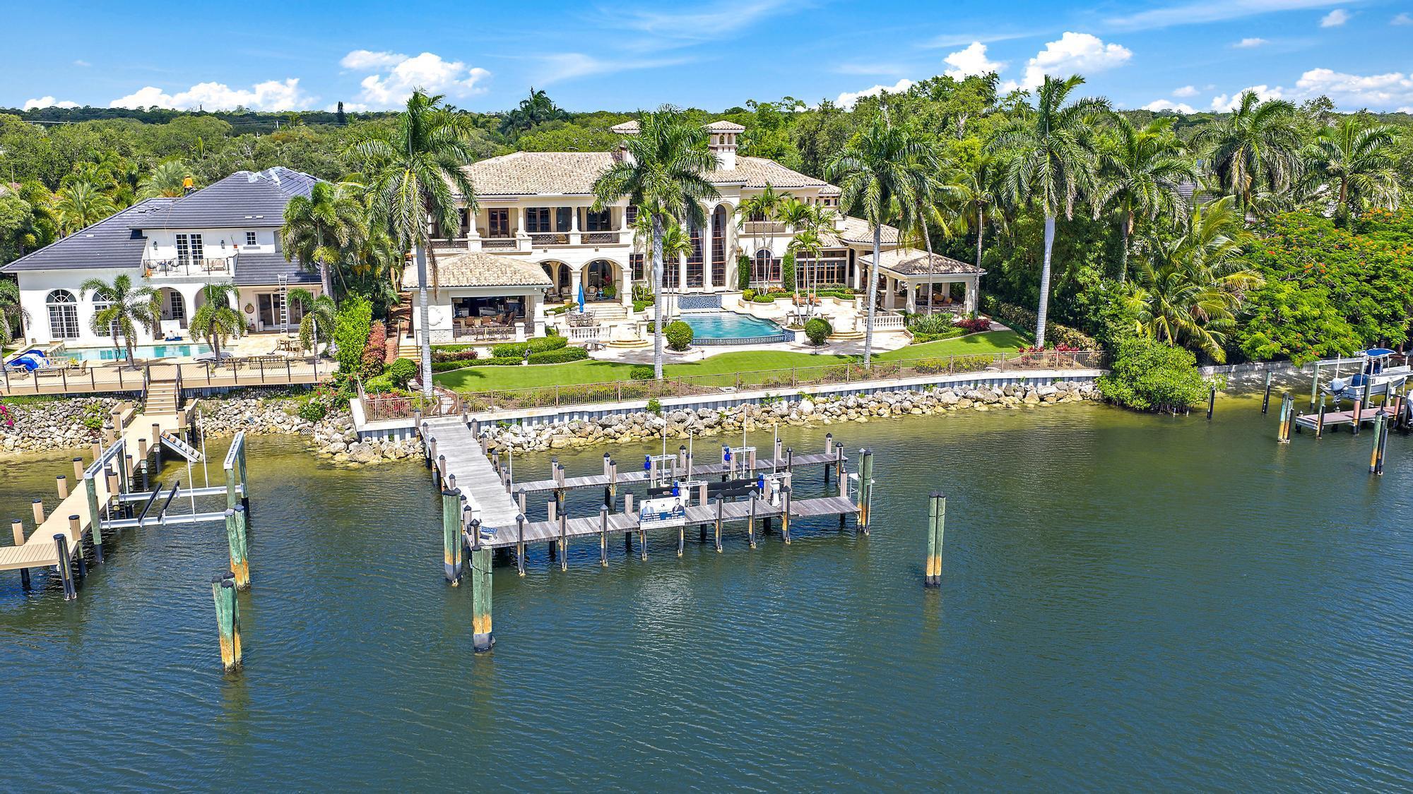 Experience the ultimate in luxury living at this exceptional Palm Beach Gardens waterfront estate. An area renowned for its world-class golf courses & boating lifestyle. Set on a rare 2.63 acres along the Intracoastal Waterway with direct ocean access. This gated residence offers 150' of intracoastal frontage & a deep-water dock. A tree-lined drive creates a private entry to the main residence, guest house, resort-style infinity pool, outdoor kitchen, & garaging with 7-car capacity. Inside, the home includes a family kitchen, separate chef's kitchen, media room, elevator, & Crestron home automation. Minutes from fine dining, luxury shopping & the Palm Beach International Airport. This estate offers a perfect blend of privacy, elegance, & access to the best of Florida's coastal lifestyle.