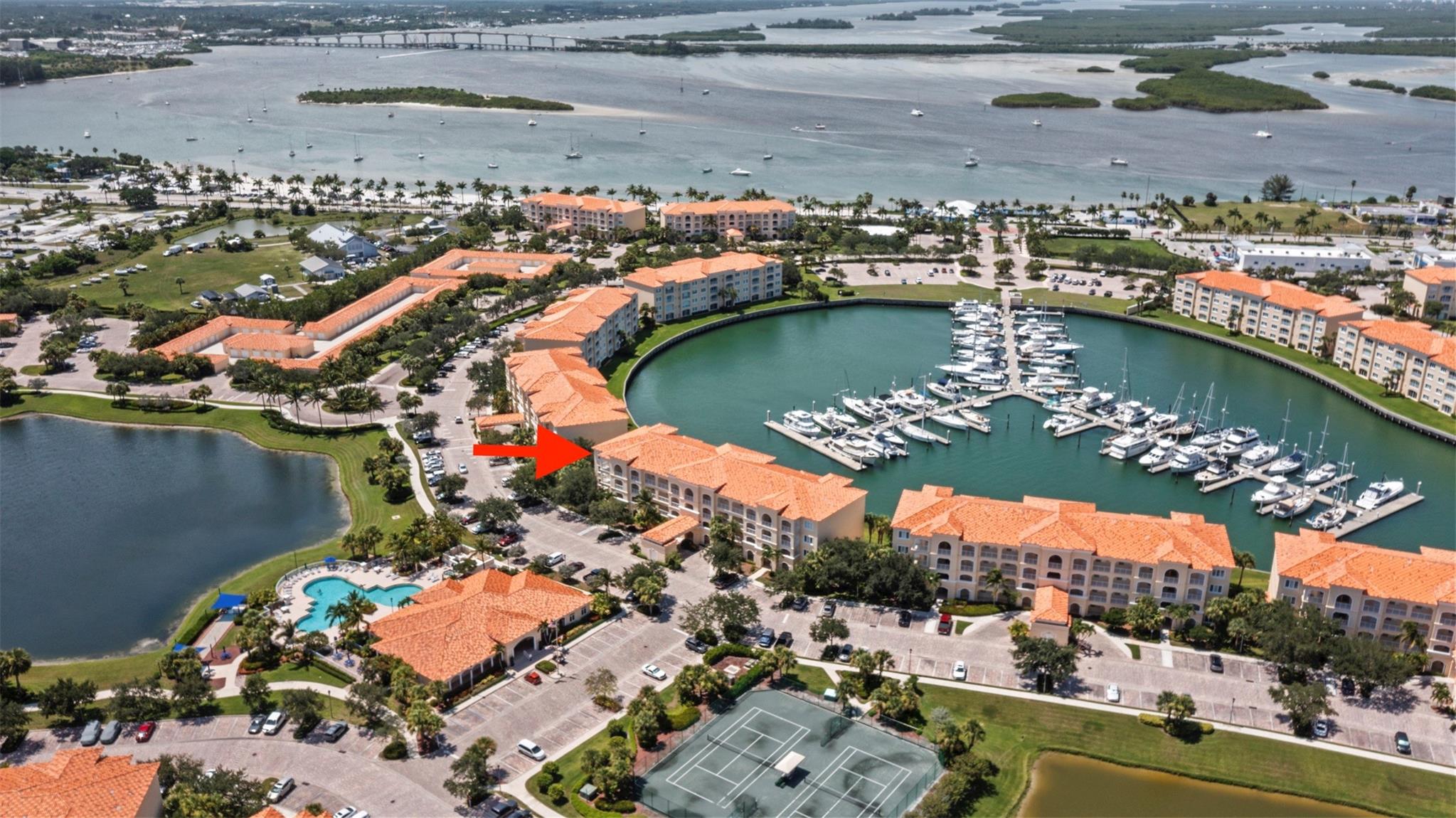 Experience contemporary coastal design in this corner penthouse condo w/ the best marina view in Harbour Isle. Not only do you see the marina, you also see the inlet & ships coming in from sea. This home blends sophistication w/ comfort & modern enthusiasts will love the brand new furnishings along w/ the pristine light carpet. Location doesn't get better as bldg 14 is directly across from the clubhouse/pool/gym & extra guest parking. Harbour isle is constructed w/ poured concrete walls, hurricane rated windows/doors, high ceilings, open floorplans, flex room off laundry room for office/add'l sleeping, 24-hour security guard, & outstanding amenities including b'ful pool, gym, walking paths, clubroom, etc. Enjoy walking to fun restaurants, farmers market, & the inlet. Furry friends welcome!