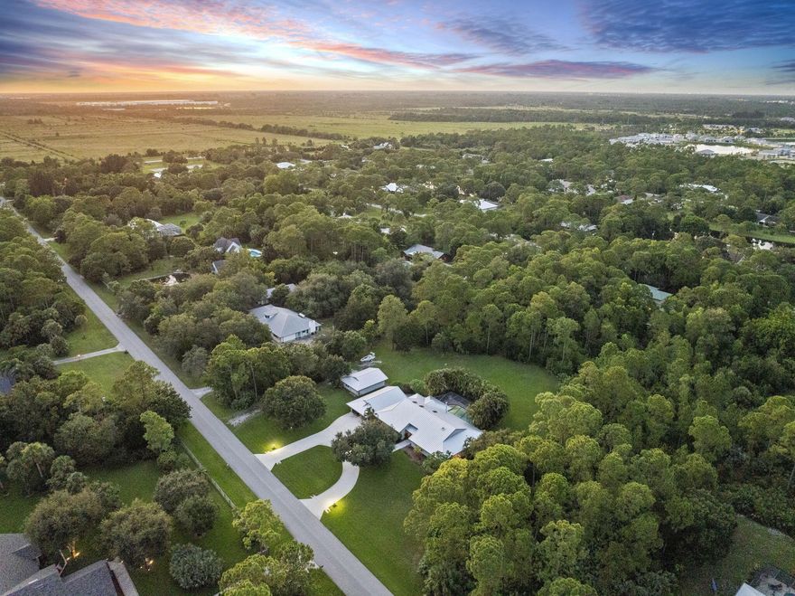 Discover this custom-built home in the beautiful equestrian community of Foxwood! Nestled on 2+ acres, this property offers endless possibilities with 2 detached buildings, ideal for a workshop, gym, game room, or art studio. Bring your boat, RV, or trailer; there's a 50-amp hookup and plenty of space. Enjoy peace of mind with a new standing seam metal roof (2024), newer impact windows, doors, sliders, and two A/C units (2025 & 2020). The main home features soaring vaulted ceilings, oversized rooms, and a screened saltwater pool perfect for entertaining. Fully fenced backyard, Ring security, central vac, and a generator add convenience and security. Zoned for horses (1 per acre), Foxwood offers a serene lifestyle in a country setting with nearby schools, churches, shopping, dining, & I95.