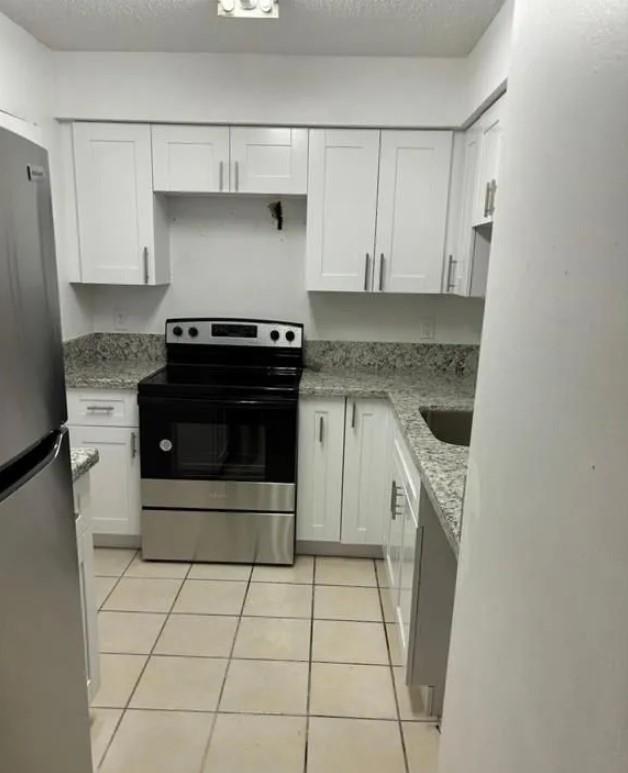 MORE PHOTOS COMING SOON
1-bedroom, 1-bath condo located in the desirable gated community of Royal Poinciana in Pompano Beach. This ground-floor unit offers approximately 813 sq ft of comfortable living space with tile flooring throughout, a fully equipped kitchen with stainless steel appliances, and an in-unit washer and dryer for added convenience. Enjoy peaceful lagoon views from your private screened patio, which also includes additional storage. The community features resort-style amenities including a clubhouse, fitness center, swimming pool, hot tub, tennis and racquetball courts, picnic areas, pet park, car wash station, and jogging paths. Near I-95, the Turnpike, shopping, dining, and just minutes from the beach and airport, this pet-friendly unit. SEE BROKER REMARKS