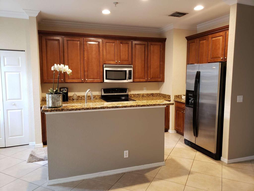 Photo of 356 W Thatch Palm Circle #106, Jupiter, FL 33458 (MLS # B26026349)