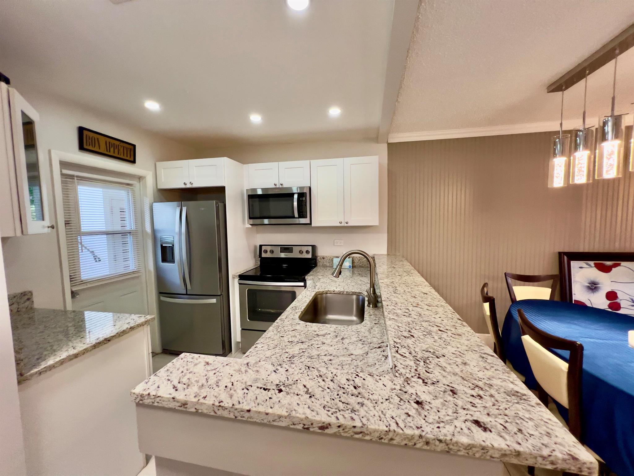 Cozy ground-floor condo in Quince Gardens at Hawaiian Gardens, a 55+ community. Fully remodeled with an open kitchen, furnished and turnkey. Enjoy serene water views of the lake. Community offers plenty of amenities and is conveniently located close to shopping, dining, and services. Can be rented after 2 years of ownership. No Motorcycles and RV.