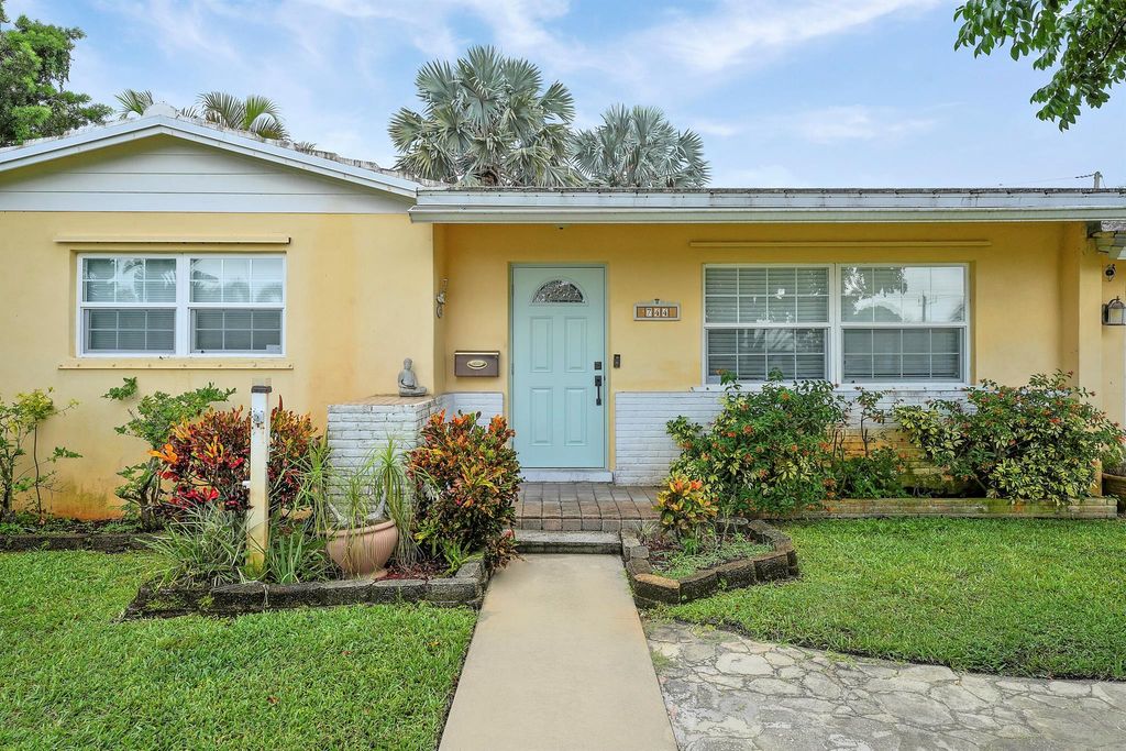 Photo of 744 W Ilex Drive, Lake Park, FL 33403 (MLS # R11103678)